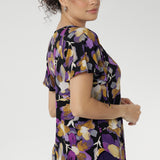 With its relaxed fit, centre-front pleat, raglan shoulders, and soft flutter sleeves, the Bowie Top drapes beautifully on the body, finished with a curved shirt-tail hemline for added movement.