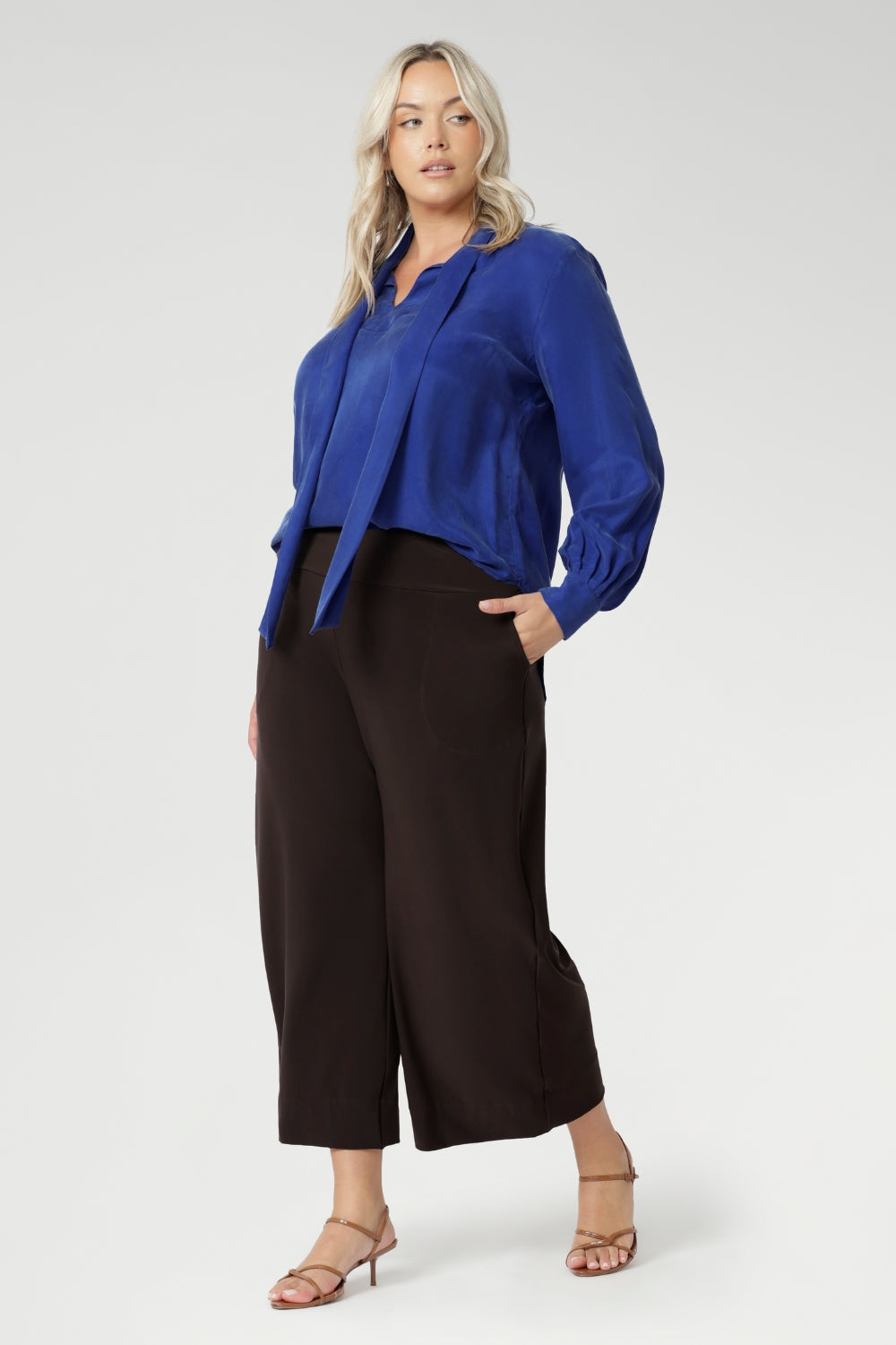 Plus size woman wears a pairBradley Culotte Pants for a comfortable soft suiting combination. Available in sizes 8-24 and in 2 lengths.