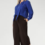 Plus size woman wears a pairBradley Culotte Pants for a comfortable soft suiting combination. Available in sizes 8-24 and in 2 lengths.