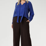 Plus size woman wears a pairBradley Culotte Pants for a comfortable soft suiting combination. Available in sizes 8-24 and in 2 lengths.