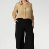 Wide leg black culotte pants are made from dry touch jersey. Worn by size 18 woman - shop online at Australian women's clothing brand Leina & Fleur in sizes 8-24, with regular & short lengths available.
