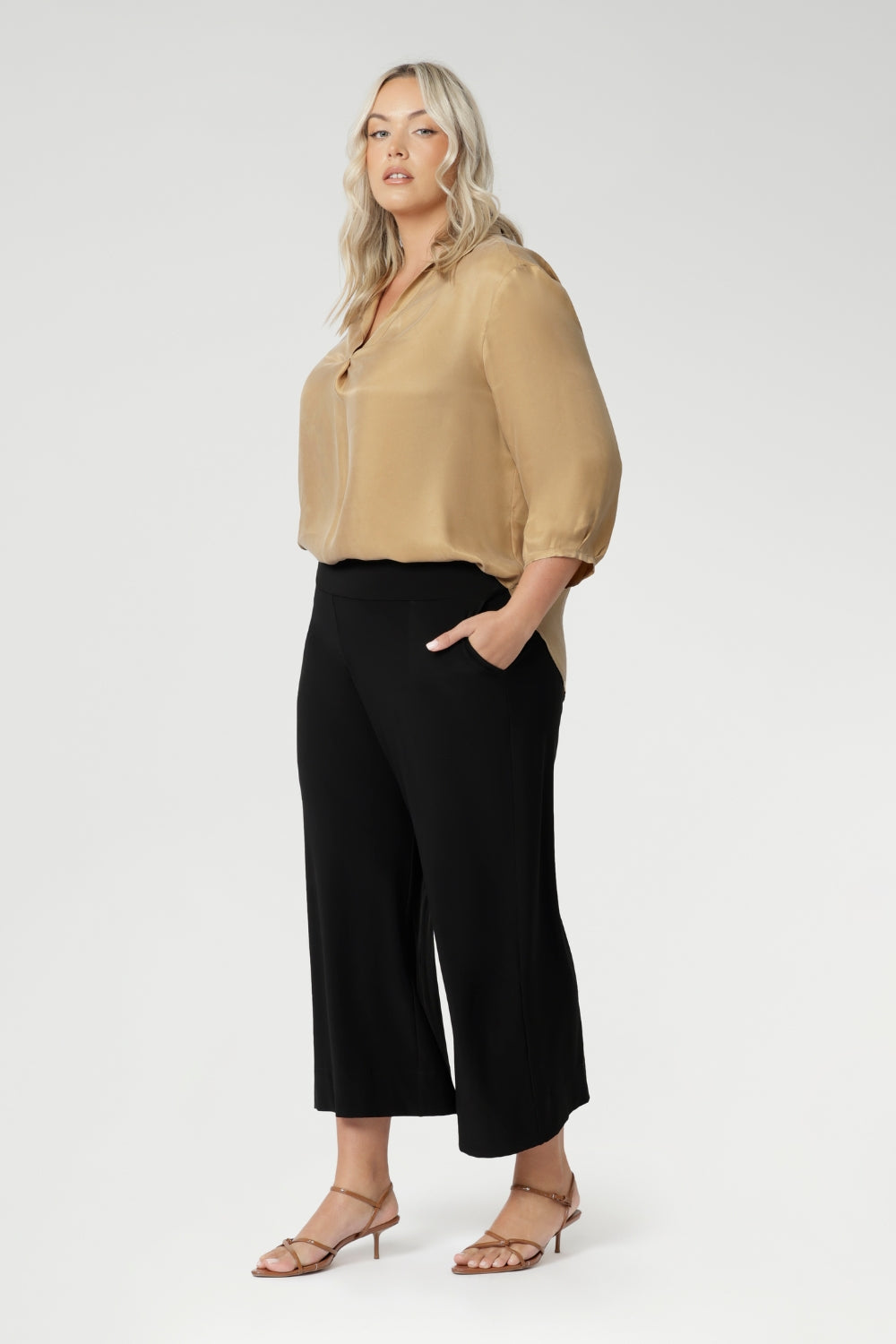 Wide leg black culotte pants are made from dry touch jersey. Worn by size 18 woman - shop online at Australian women's clothing brand Leina & Fleur in sizes 8-24, with regular & short lengths available.