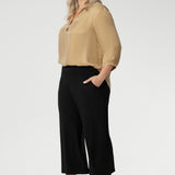 Wide leg black culotte pants are made from dry touch jersey. Worn by size 18 woman - shop online at Australian women's clothing brand Leina & Fleur in sizes 8-24, with regular & short lengths available.