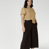 Petite Height woman wears a pair of Bradley Culotte Pants for a comfortable soft suiting combination. Available in sizes 8-24 and in 2 lengths.