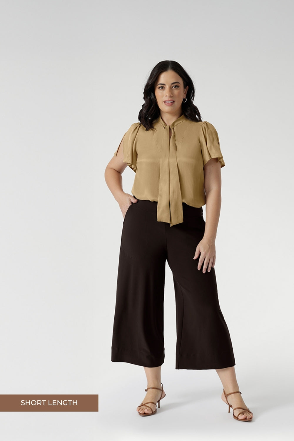 Petite Height woman wears a pair of Bradley Culotte Pants for a comfortable soft suiting combination. Available in sizes 8-24 and in 2 lengths.