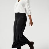 With a cropped length that’s ideal for showcasing shoes and providing a contemporary silhouette, these culottes are designed to elevate your professional style. The deep hem enhances the durability and structure of the pant, ensuring it retains its polished appearance over time. Available in sizes 8-24