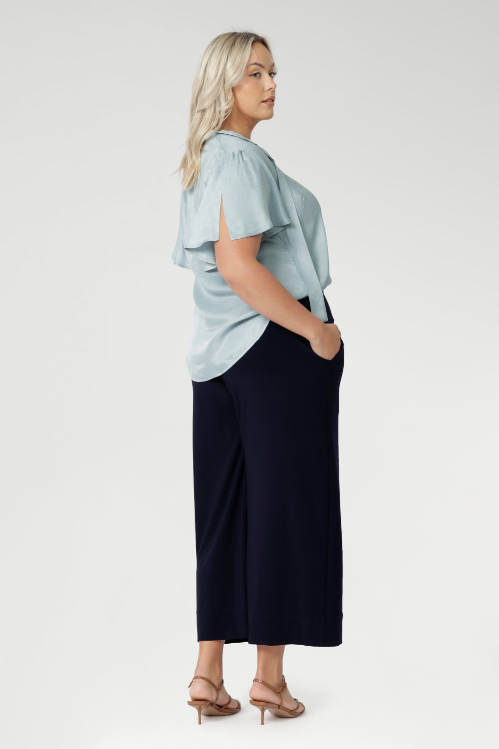 Back view image of plus size woman wears The Bradley Culotte Pant in Navy. Stylish Pant For Any Height. Easy Care, easy wear and feel so comfortable to wear. Available in 2 Different Lengths for petite and tall women. Available in Sizes 8-24. Made in Australia.