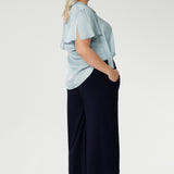 Back view image of plus size woman wears The Bradley Culotte Pant in Navy. Stylish Pant For Any Height. Easy Care, easy wear and feel so comfortable to wear. Available in 2 Different Lengths for petite and tall women. Available in Sizes 8-24. Made in Australia.