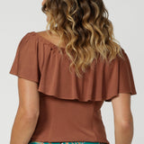 Off the shoulder top for summer, this slinky jersey top is a good top for petite height women. Shown on a size 12 woman, this easy-care top is made in Australia by Australian and New Zealand women's clothing brand, Leina & Fleur. Shop off the shoulder top that can be worn 3 ways in sizes 8-24.