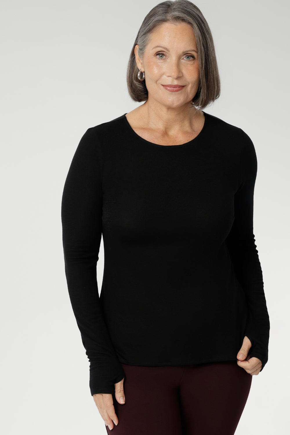 Crafted from a luxe blend of Tencel wool, this soft knit top is your go-to light layer for the cooler months. Featuring a classic round neckline and long sleeves, it’s designed with comfort in mind — offering generous stretch and a smooth, breathable feel, without the itch of traditional merino. Worn solo or layered under a jacket or coat, it pairs effortlessly with your favourite pants or skirts for an elegant, everyday look.