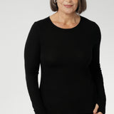 Crafted from a luxe blend of Tencel wool, this soft knit top is your go-to light layer for the cooler months. Featuring a classic round neckline and long sleeves, it’s designed with comfort in mind — offering generous stretch and a smooth, breathable feel, without the itch of traditional merino. Worn solo or layered under a jacket or coat, it pairs effortlessly with your favourite pants or skirts for an elegant, everyday look.