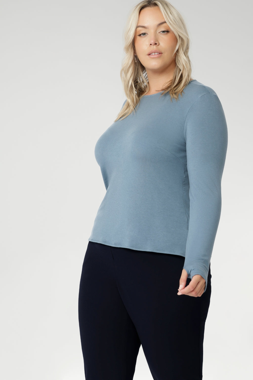 Crafted from a luxe blend of Tencel wool, this soft knit top is your go-to light layer for the cooler months. Featuring a classic round neckline and long sleeves, it’s designed with comfort in mind — offering generous stretch and a smooth, breathable feel, without the itch of traditional merino. Worn solo or layered under a jacket or coat, it pairs effortlessly with your favourite pants or skirts for an elegant, everyday look.