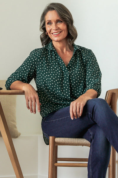 Ahead of the trends, classic shirts always look stylish - try this pull-on style with full collar, shirttail hem and 3/4 sleeves styled here with jeans for the perfect weekend breakfast outfit. We love the polka dot print against green for a fresh look.