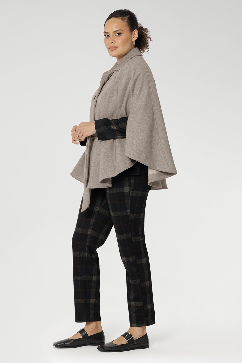 Step into the cooler seasons wrapped in timeless elegance with the women’s winter cape by Leina + Fleur. Proudly Australian made, this luxurious cape is crafted from a premium blend Tencel, silk, and wool—offering the perfect harmony of softness, warmth, and breathable comfort. Ideal for layering, it delivers a spacious yet flattering fit designed to move with you through winter in effortless style.