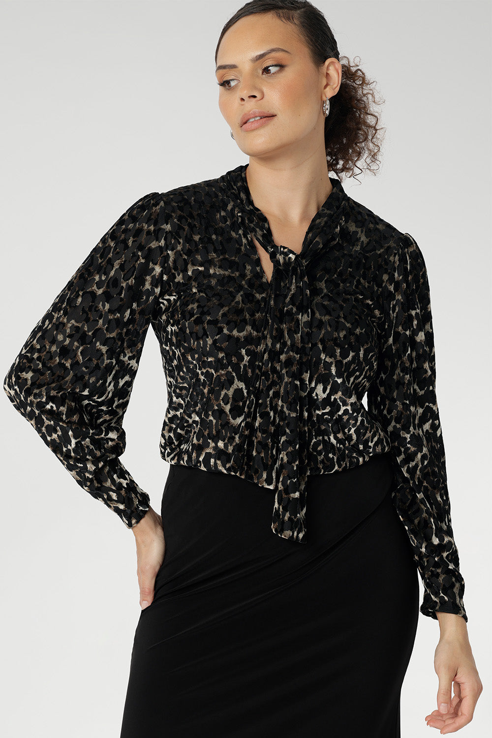 The striking animal burnout print is set against a soft, stretchy black jersey base that offers comfort without compromising on style.