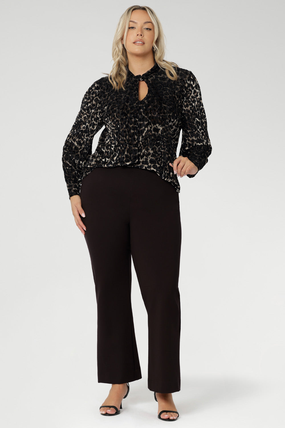 The Celine Top in Animal Burnout is a sophisticated statement piece, expertly crafted from luxurious velour fabric with a distinctive burnout effect. Designed to transition seamlessly from office wear to special events, this versatile blouse can be styled tucked in for a polished look or worn loose for effortless elegance.