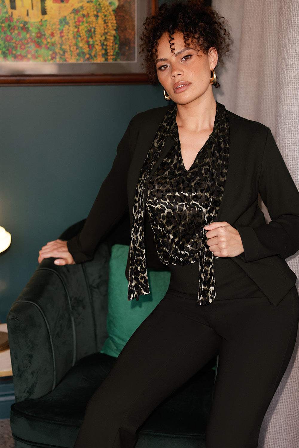 The Celine Top in Animal Burnout is a sophisticated statement piece, expertly crafted from luxurious velour fabric with a distinctive burnout effect. Designed to transition seamlessly from office wear to special events, this versatile blouse can be styled tucked in for a polished look or worn loose for effortless elegance.