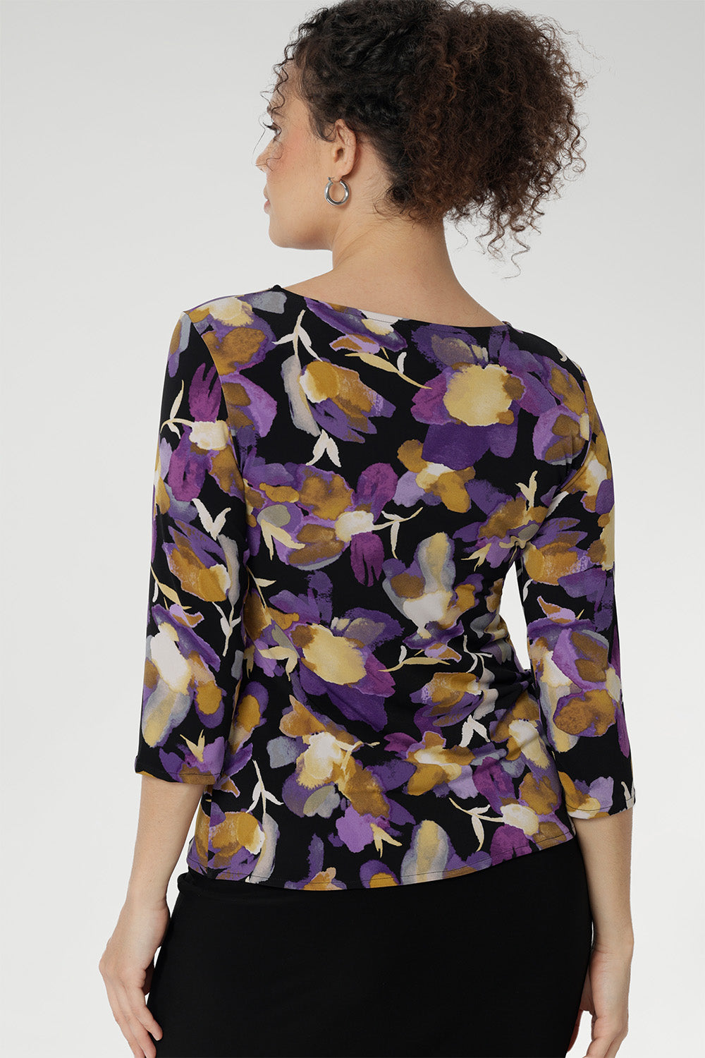 Floral printed top showcases a stunning painterly-style floral print with rich purples and soft yellow hues that bring any outfit to life. Whether you're dressing it up or wearing it under a jacket for a corporate burst of colour. Available in size 8-24.