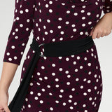 The Black D-ring belt offers endless styling potential—ideal for office wear, weekend outfits, and everything in between. Proudly made in Australia, it’s the perfect finishing touch to elevate your work-to-weekend wardrobe with ease and sophistication. Burgundy spotted dress for event dressing.