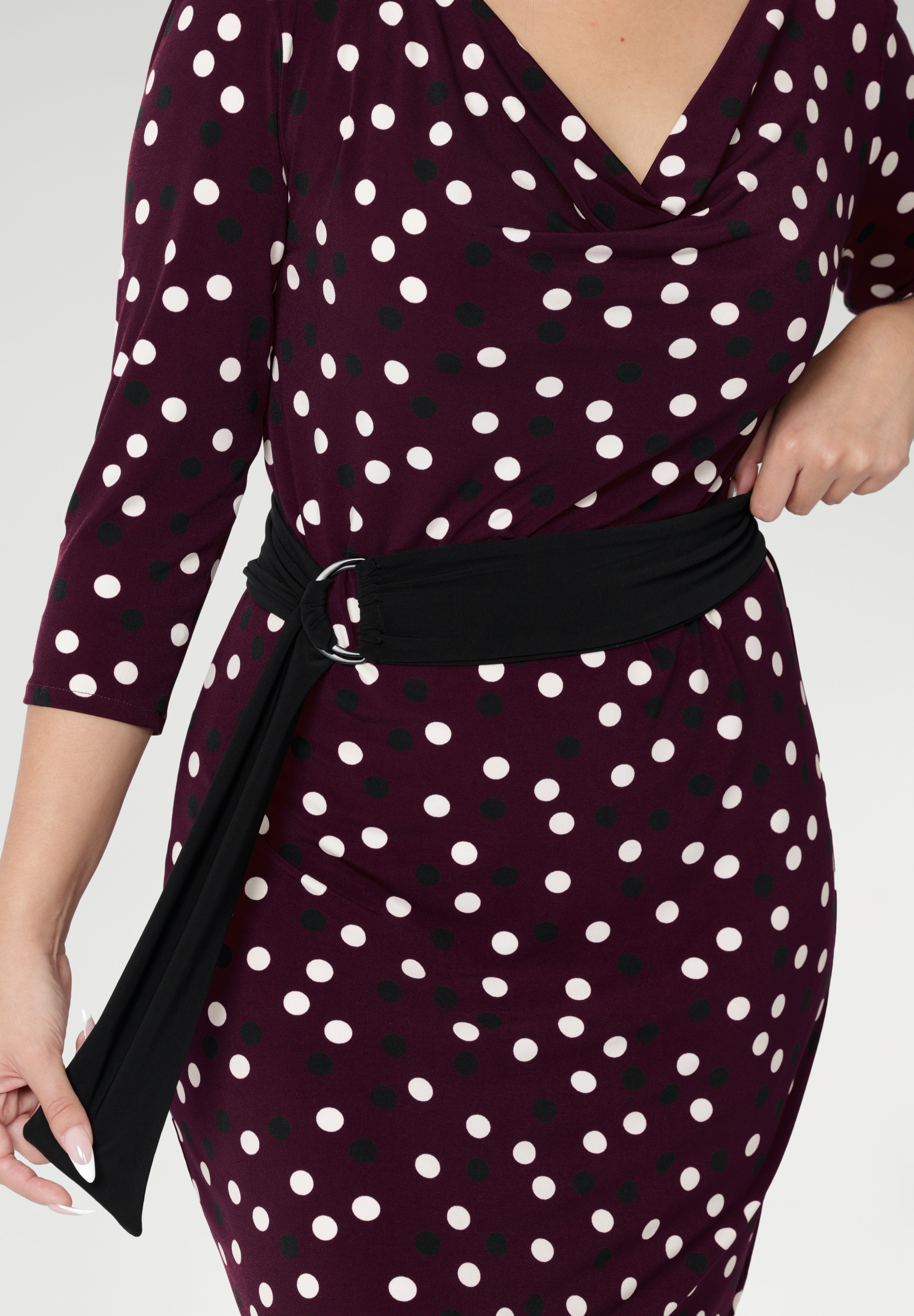 The Black D-ring belt offers endless styling potential—ideal for office wear, weekend outfits, and everything in between. Proudly made in Australia, it’s the perfect finishing touch to elevate your work-to-weekend wardrobe with ease and sophistication. Burgundy spotted dress for event dressing.