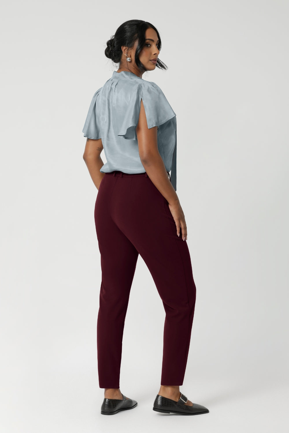 The tapered legs give the pants a modern, flattering silhouette, and the ankle-length design offers a chic, versatile look. Available in sizes 8-24 and in different colours and styles.