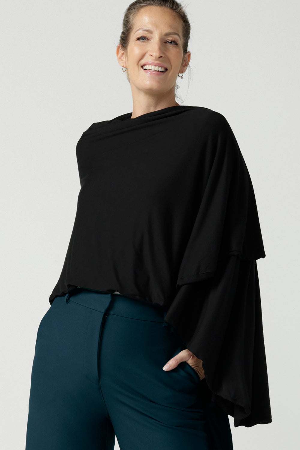 Model is wearing In thermo-regulating, luxurious bamboo jersey Poncho in Black Bamboo by Australian Made brand Leina&Fleur specialising ladies wear in sizes from 8 to 24