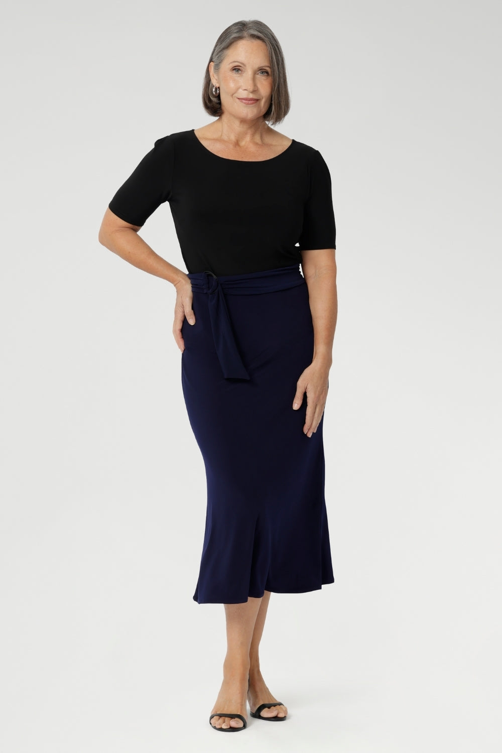 The Asher Skirt in Navy is the ideal blend of style and comfort, designed for both casual and elevated moments. Perfect for workwear, this skirt offers a sleek, flattering fit without sacrificing comfort. Made from dry-touch jersey fabric with soft stretch, it features a bias-cut design that creates a smooth, flowing silhouette.