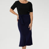 The Asher Skirt in Navy is the ideal blend of style and comfort, designed for both casual and elevated moments. Perfect for workwear, this skirt offers a sleek, flattering fit without sacrificing comfort. Made from dry-touch jersey fabric with soft stretch, it features a bias-cut design that creates a smooth, flowing silhouette.