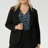 Jersey shirt features a flattering V-neckline with a soft front tuck that adds structure without stiffness, full-length sleeves for added coverage, and a gently curved shirttail hem that creates a clean finish whether worn tucked or loose. A shoulder yoke and centre-back tuck lend subtle tailoring to the relaxed silhouette, making it easy to dress up or down.