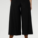 Women's black work pants have a smooth waistband, side pockets and are pull-on pants made in stretch jersey. Made in Australia, the pants are size inclusive in sizes 8 - 24.