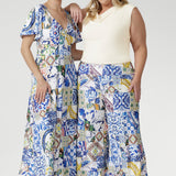 Inspired by Mediterranean charm, the Dany Culotte in Mosaic Tile is crafted from our signature soft-touch stretch jersey, offering luxurious comfort and elegant flow. The intricate mosaic print, featuring shades of cobalt, yellow, brown, and green, adds vibrancy to the clean white base. Designed with a pull-on elastic waistband, wide cropped legs, and functional pockets, it combines ease of wear with refined detail.