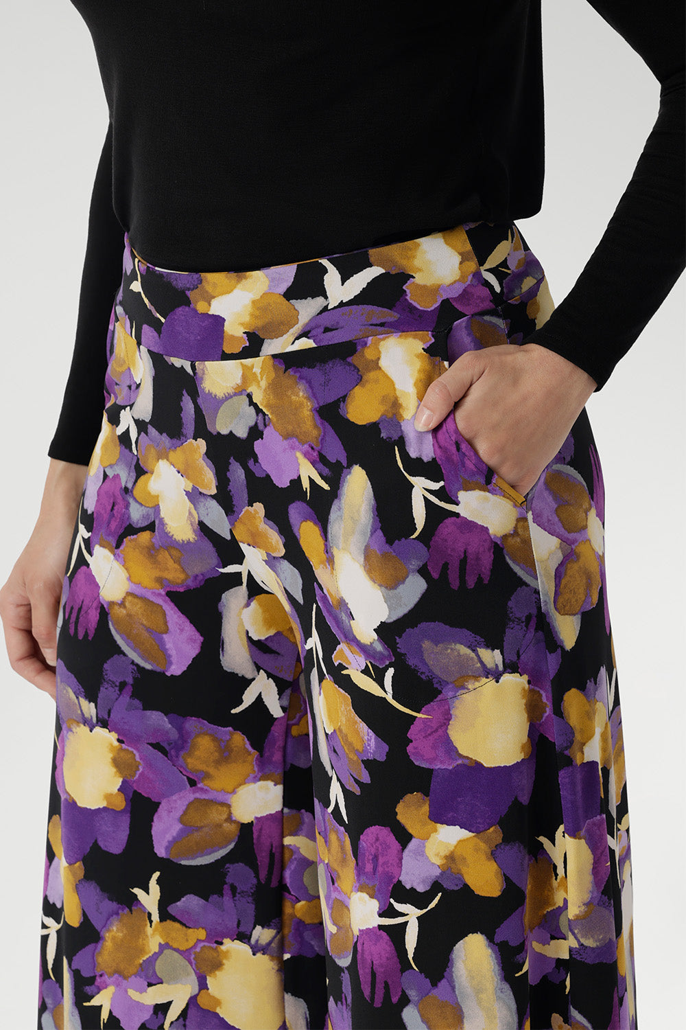 Made from our signature dry-touch jersey fabric with a soft stretch, these beautifully crafted culottes feature a striking painterly-style floral print in rich purples and soft yellow hues that instantly catch the eye.