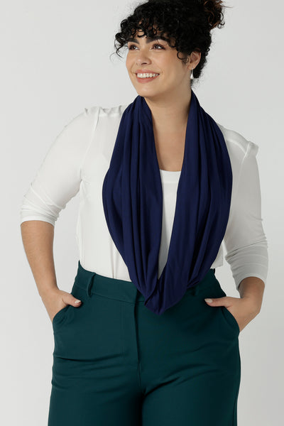 Woman wears bamboo fibre desiree scarf in french navy. Comfortable and heat regulating bamboo. Made in Australia style for women size 8 - 24.