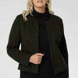 This cropped, collarless jacket features a round neckline and an open-front design, making it a versatile layering essential for the office, weekend outings, or travel.