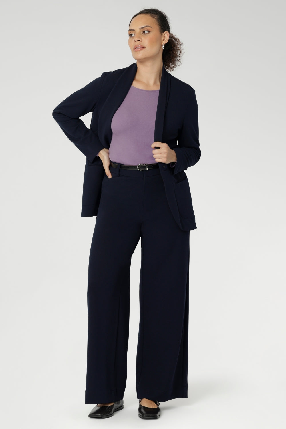 Women's workwear pants in Navy feature wide leg pant pant that feature a high waist, tailored belt loops and straight leg. Stylish and corporate workwear for women size 8 - 24. Made in Australia.