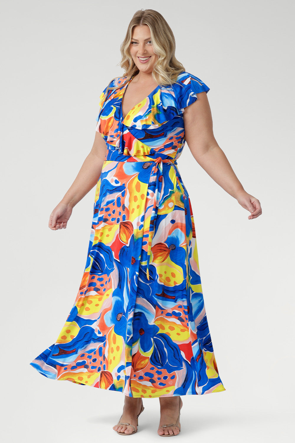 Easy to wear and beautifully flattering, the Elle Maxi Wrap Dress in Summer Bliss is made from our cool-touch slinky jersey for all-day comfort. Its classic wrap shape and tie waist enhance your figure, while the raw edge frill adds a soft, modern finish.