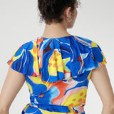 Crafted from cool-touch slinky jersey, it features a flattering wrap design with a tie waist and a laser-cut raw edge frill that lends a light, contemporary edge. Finished in a bold abstract floral print, with pockets and a double-layered back for comfort, it’s the perfect piece for festive summer occasions.
