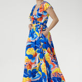 The Elle Maxi Wrap Dress in Summer Bliss is crafted from our cool-touch slinky jersey for a soft, breathable feel. A tie waist defines the silhouette, while the raw edge frill brings a light, feminine finish. With its vibrant abstract floral print and thoughtful details like pockets and a double-layered back, it’s the ultimate dress for summer celebrations and sunny escapes.