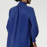 Suede touch Tencel shirt features a collared V-neckline, cuffed sleeves and shirttail hemline that sits longer at the back. Womans workwear blouse has a luxurious feel and drape. Proudly made in Australia in sizes 8-24.