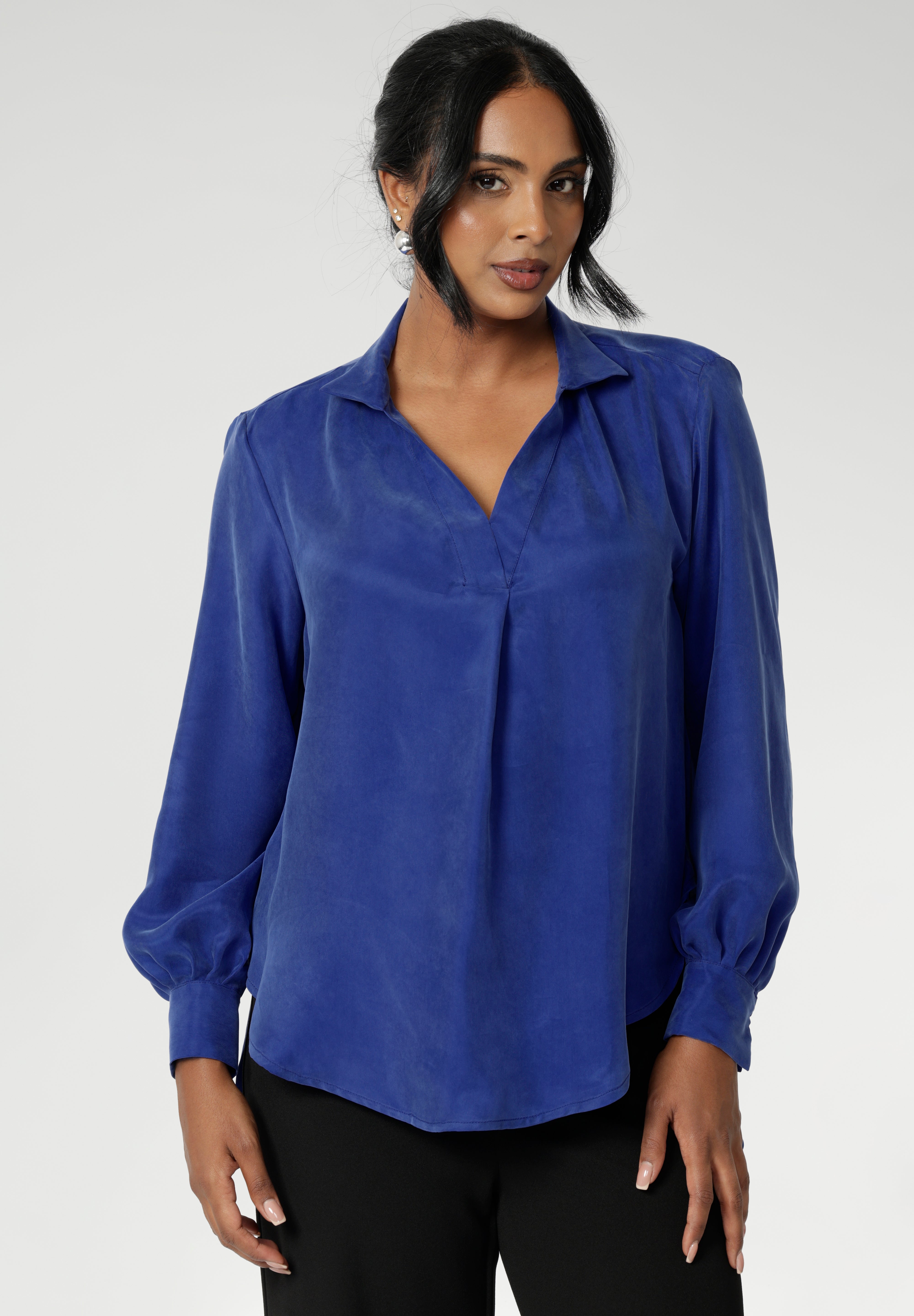 Ellis is a pull-on style shirt featuring a collared V-neckline, cuffed sleeves and shirttail hemline that sits longer at the back. Crafted from suede touch Tencel fabric that has a luxurious feel and drape. Proudly made in Australia in sizes 8-24.