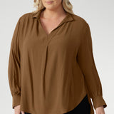 Designed to be worn untucked or styled with a front or back tuck, it transitions seamlessly from relaxed to refined. Crafted from a breathable Tencel Viscose, the fabric has a soft drape and a gentle texture. It’s lightweight, easy to wear, and holds its shape without stretch. In the warm neutral shade of Nuthatch, it brings subtle sophistication to everyday dressing.