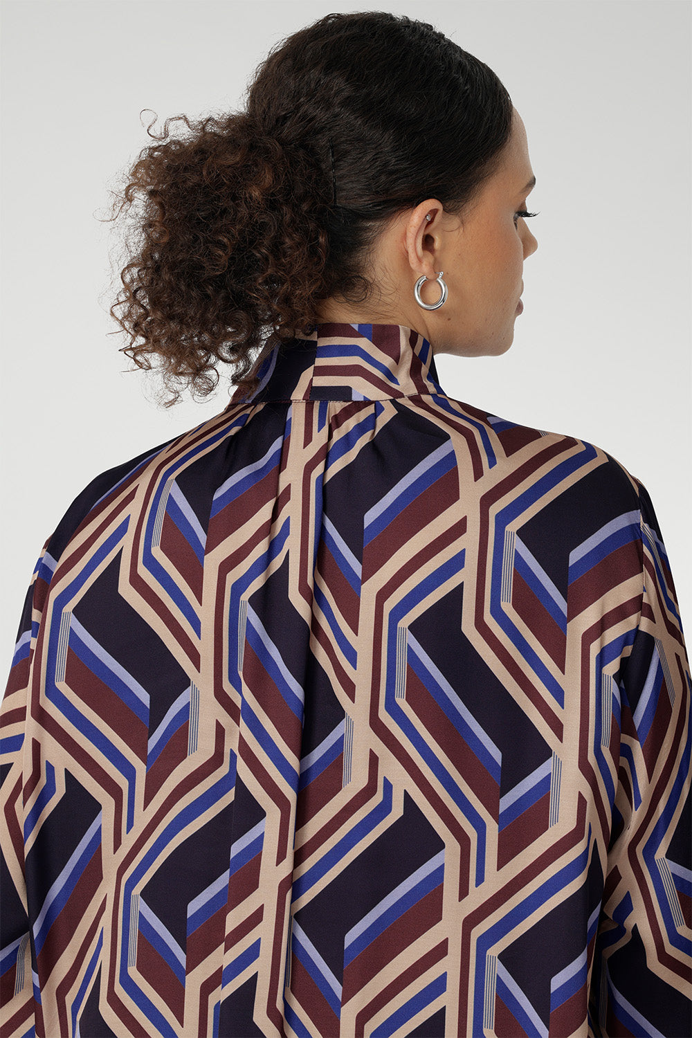 This eye-catching piece offers a fresh take on classic shirting with its flowing silhouette and modern detailing. The Ellis Shirt is a versatile, statement-making piece perfect for work, weekends, or layering under jackets throughout the season.