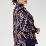 Showcasing a bold geometric striped print, this eye-catching piece offers a fresh take on classic shirting with its flowing silhouette and modern detailing. Crafted for comfort and movement.