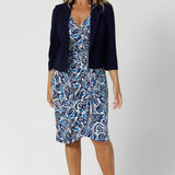 The knee-length tulip skirt gracefully hugs the body and then flares out slightly, offering a flattering and feminine shape that works beautifully for both work and after-hours events. Whether you're pairing it with the Benni Jacket for a polished office look or wearing it solo for a more casual weekend outing, the Emori Wrap Dress is as versatile as it is stylish.
