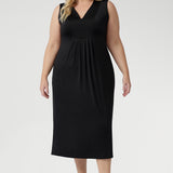 Australian-made Fernanda Dress in Black featuring soft stretch fabric, side splits, and cool-touch comfort for effortless summer style.