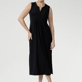 Fernanda Dress in Black — sleeveless slinky midi sundress with front pleats and waist ties, perfect for summer getaways and resort wear.