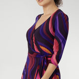 Fiona features a 3/4 sleeves with softly gathered sleeve heads and side pockets that enhance both the style and practicality of this piece. Model wears a size 10 wrap dress.