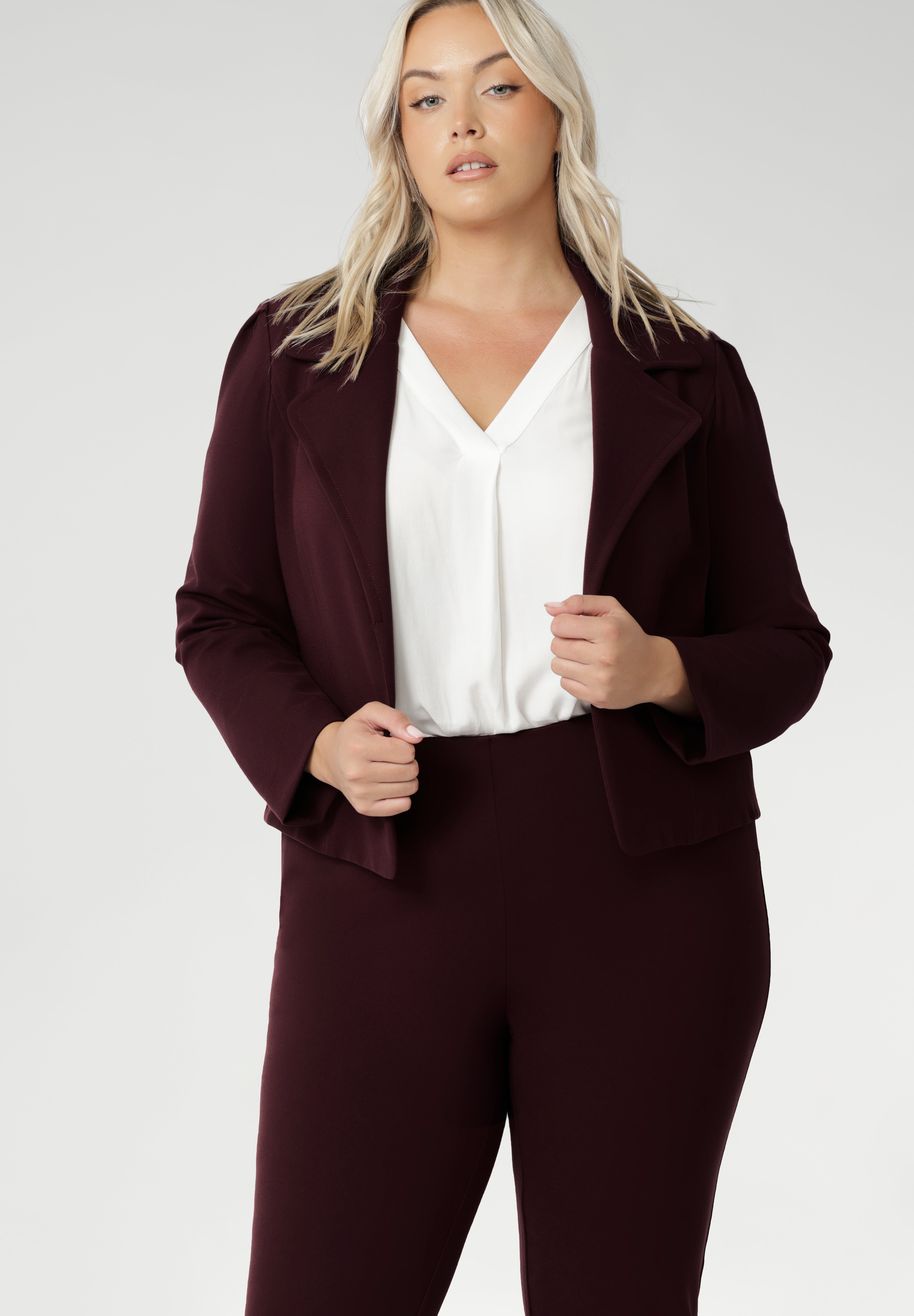 The Garcia Jacket in Burgundy is a modern cropped trench with a tailored, open-front design. Made from firm-stretch fabric, it’s an effortless layering piece for off-duty or workwear looks. Garcia features an open fronted jacket with collar and notch lapels with topstitch details. Double layer jacket is tailored with front panels and back darts. Proudly made in Australia in sizes 8-24.