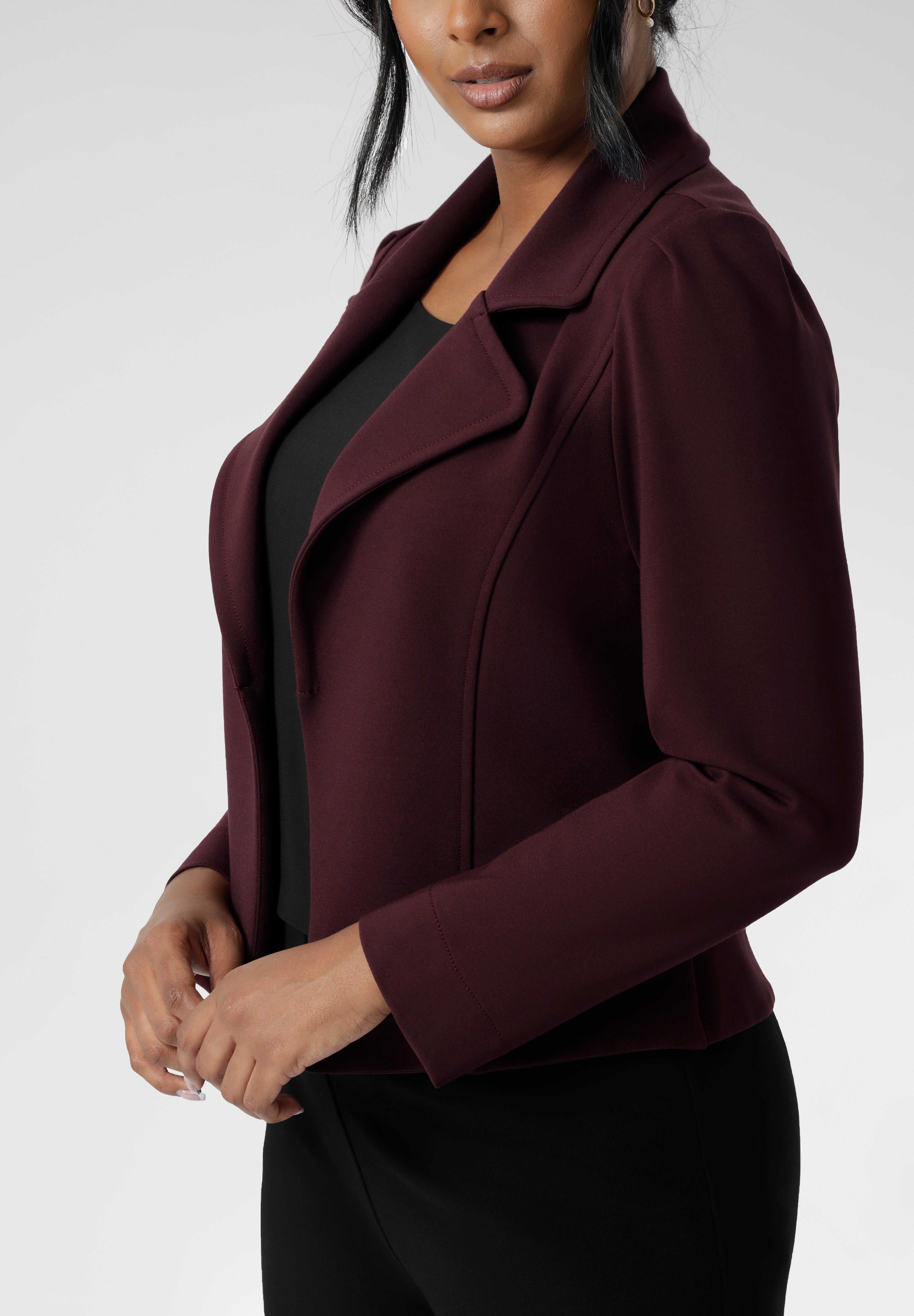 Garcia features an open fronted jacket with collar and notch lapels with topstitch details. Double layer jacket is tailored with front panels and back darts. Proudly made in Australia in sizes 8-24. Size 10 woman wears her jacket with black black workwear pants.