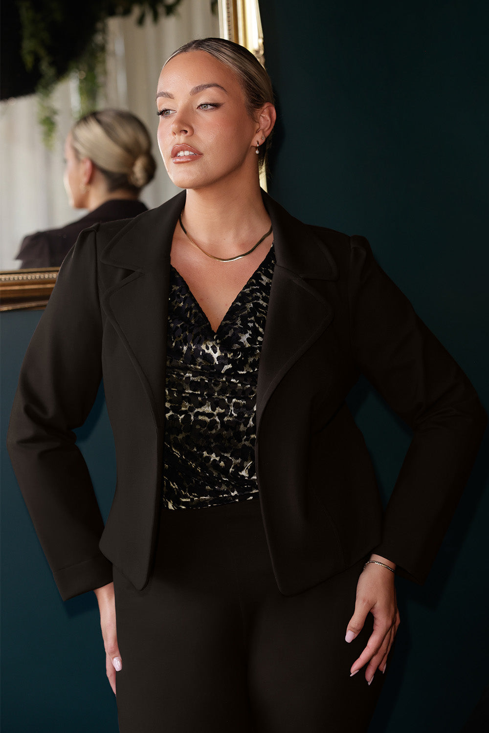 The Garcia Jacket is a modern interpretation of the classic trench, reimagined in a chic cropped silhouette. Expertly crafted from premium dry-touch Ponte jersey fabric with firm stretch, this tailored open-front jacket offers structure, comfort, and ease of movement.
